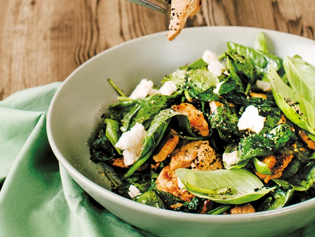 Stir-fried chicken and basil salad on just-wilted spinach.jpg