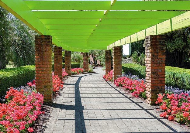 A brightly coloured walkway leads to the Homestead Garden