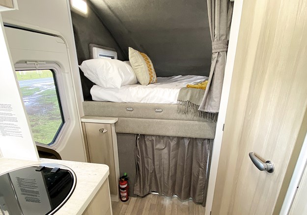 The comfy bed is located over the cab