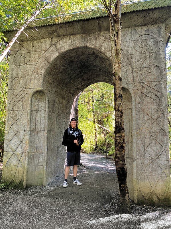 LOTR fan Gareth standing in the famous Rivendell arch_big.jpg